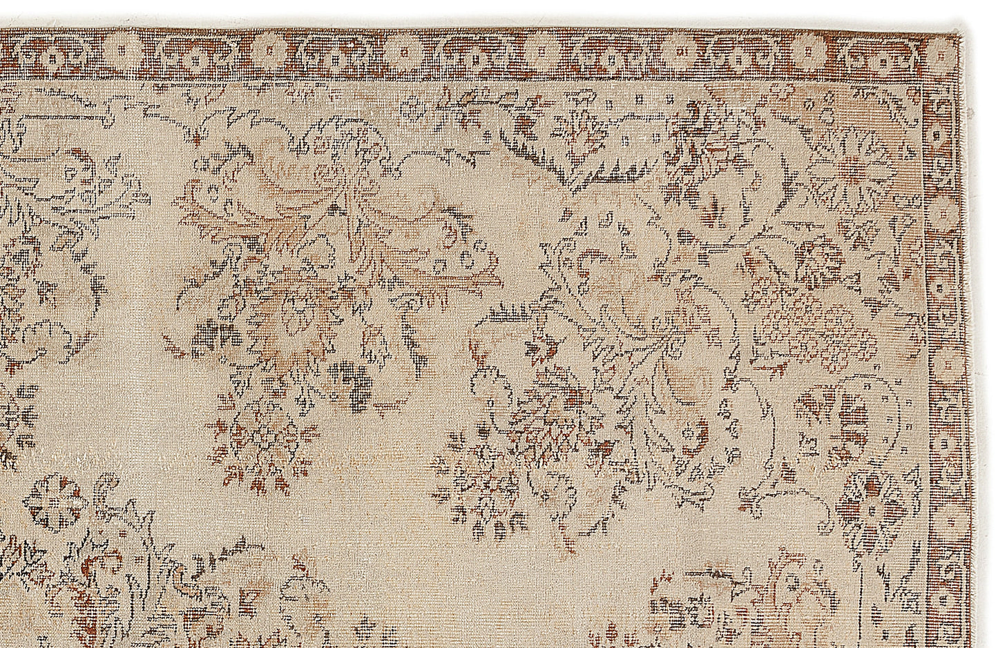A close-up of the Tefaas - Vintage Floral Rug (6'8 x 9'7) shows its intricate Persian-inspired floral pattern in muted brown, blue, and tan tones, bordered by a decorative strip with small flower motifs.