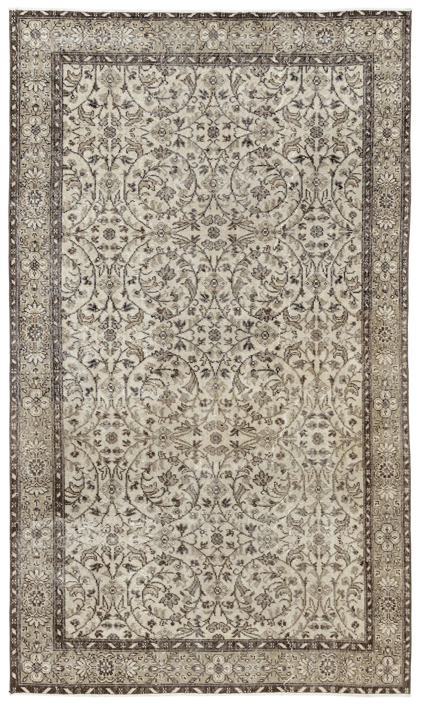The Sigima Vintage Floral Rug (5'4 x 9'1) is a rectangular Anatolian hand-woven piece with an intricate, symmetrical beige, ivory, and brown floral and vine pattern, framed by a detailed decorative border.