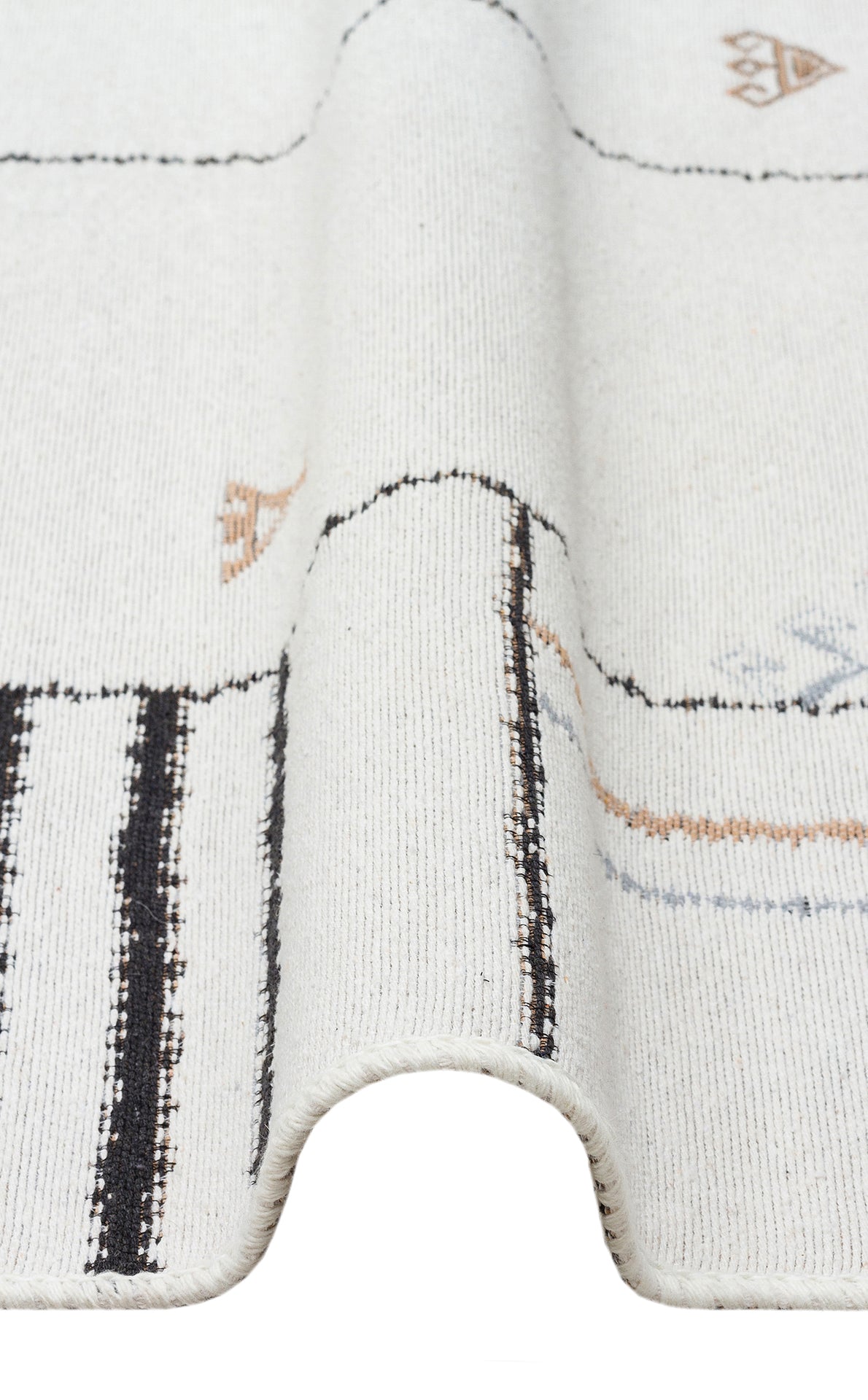 A close-up of the Fog Detail - Washable Double-Sided Kilims - AR40, a white reversible rug featuring black, tan, and blue geometric designs with a textured wave—crafted from recycled cotton for sustainable style.