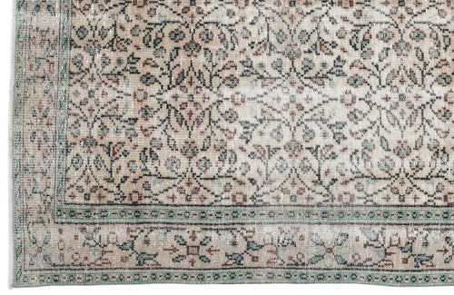 Load image 1 in gallery view. Beige and teal traditional rug with a distressed floral medallion pattern and a decorative border.