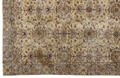 Load image 1 in gallery view. Distressed beige and tan rug with a faded floral medallion pattern and a dark border.