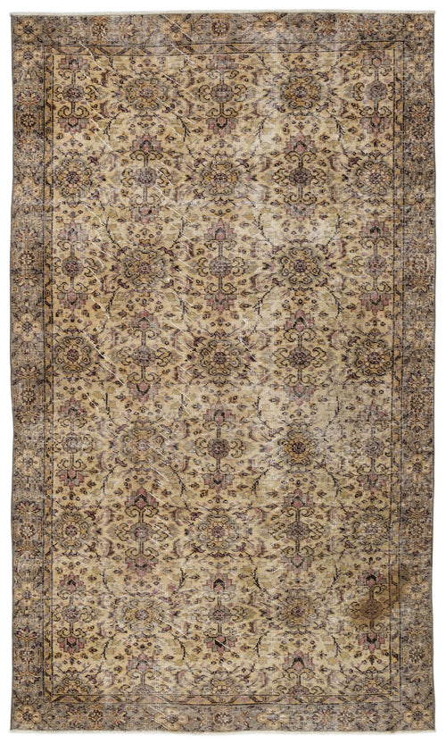 Load image 1 in gallery view. Distressed beige and brown traditional rug with a repeating floral medallion pattern and a dark border.