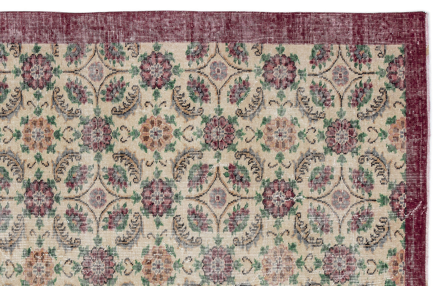 Beige rug with a repeating floral medallion pattern in burgundy, green, and tan, featuring a wide burgundy border.