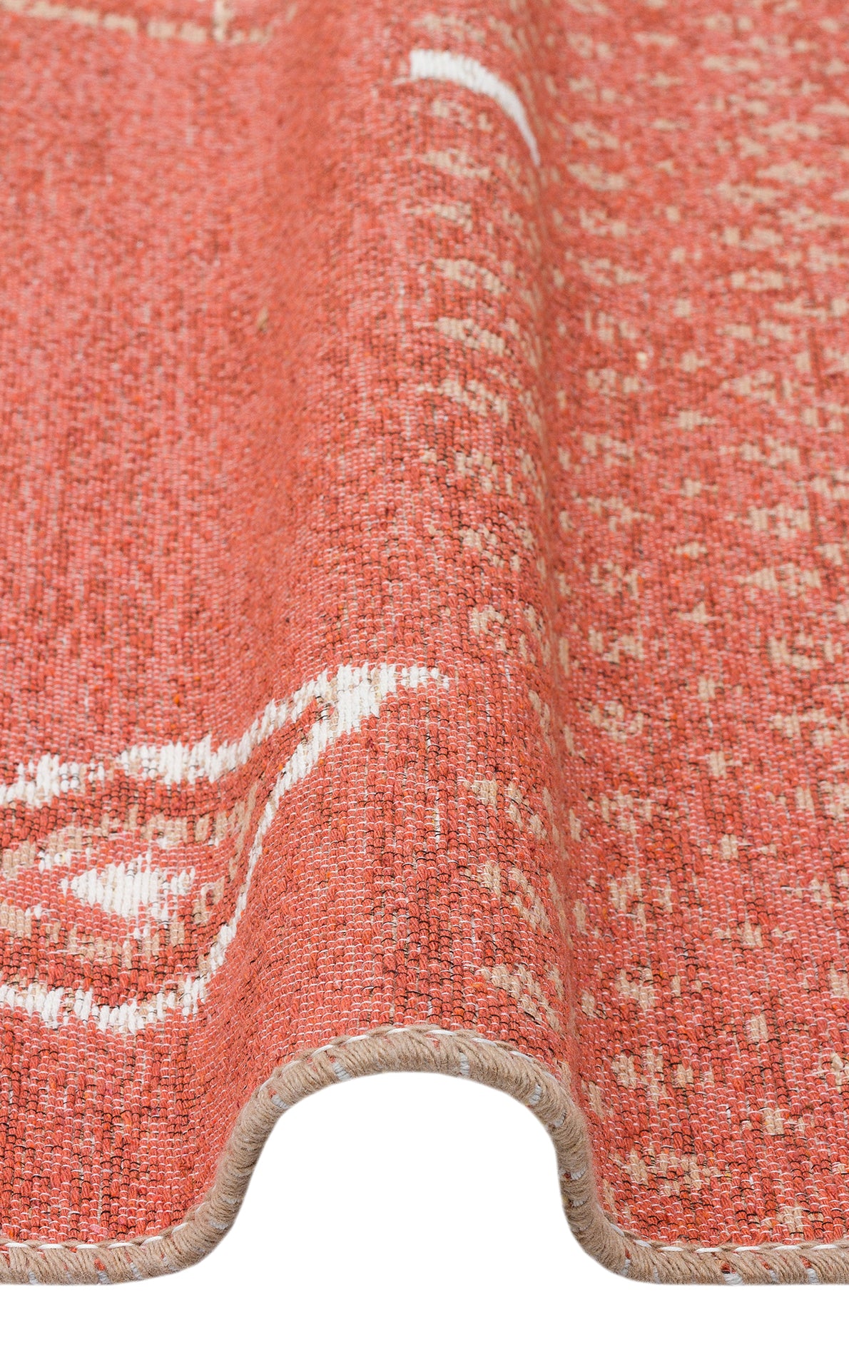 A close-up of the Clay Blend - Washable Double-Sided Kilims - AR37 shows its textured orange and white pattern, wavy fold, and woven edge—ideal for adding boho style to any space.