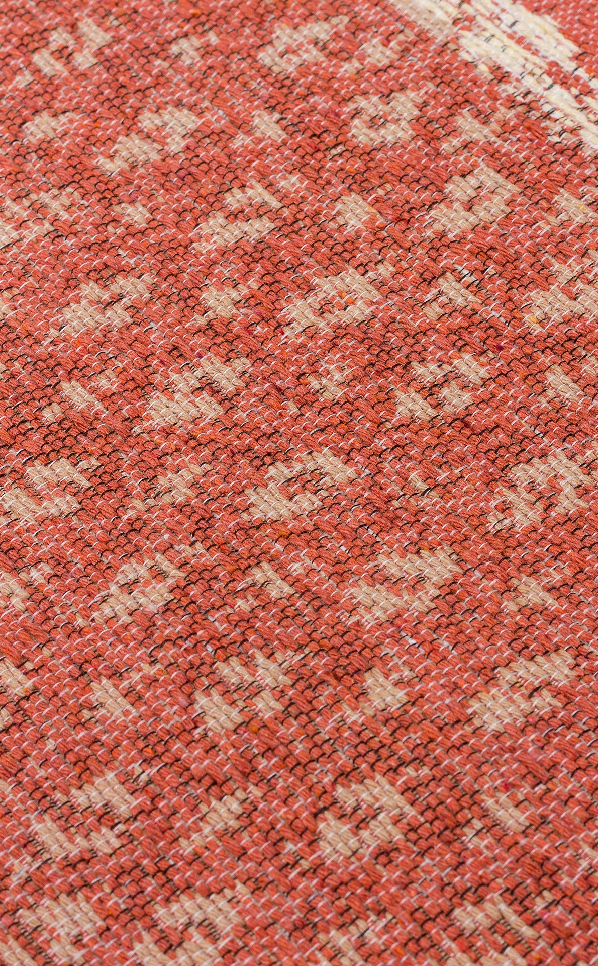 Close-up of the Clay Blend - Washable Double-Sided Kilims - AR37, featuring visible orange and beige woven threads with a subtle, irregular pattern and textured finish—ideal for adding a bohemian touch to your home decor.