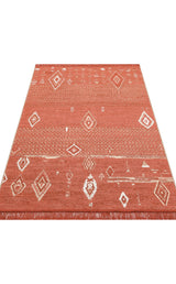 The Clay Blend - Washable Double-Sided Kilims - AR37 is a rectangular, terracotta-hued recycled cotton rug with white geometric patterns and fringed ends—ideal for adding bohemian flair to your home decor.