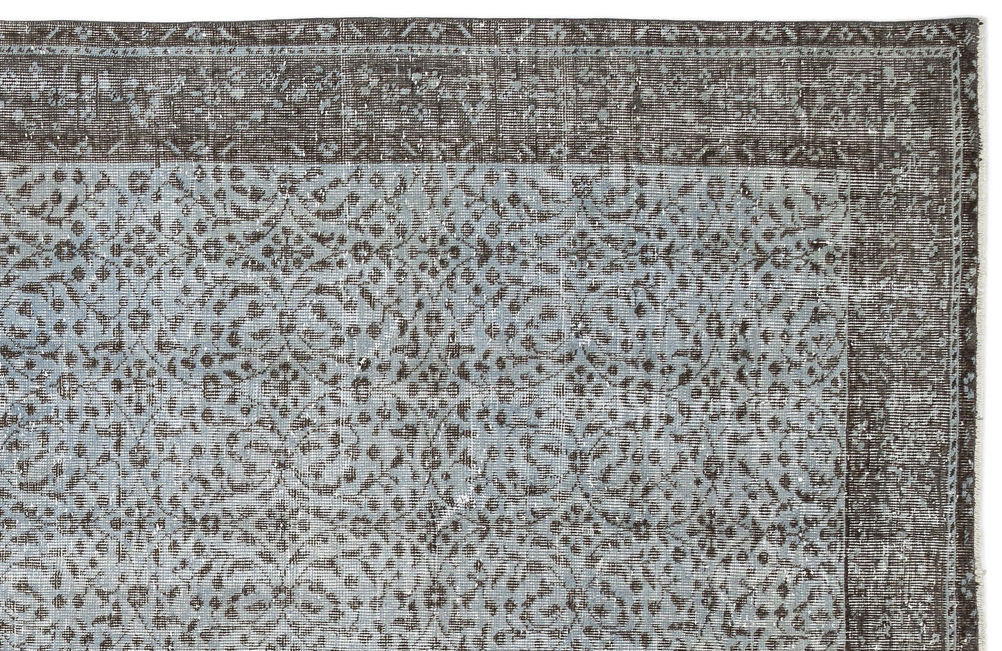 Charcoal and light blue distressed rug with a traditional floral medallion pattern and a wide decorative border.