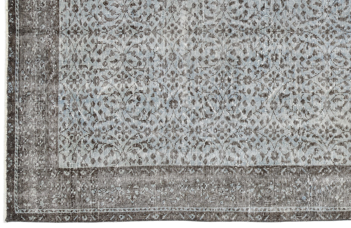 Distressed light blue and charcoal grey rug with a traditional ornate floral pattern and a wide solid border.