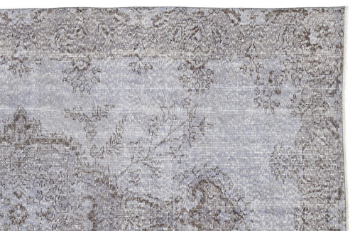 Load image 1 in gallery view. Light blue and charcoal grey rug with a distressed, traditional floral medallion pattern on a white background.