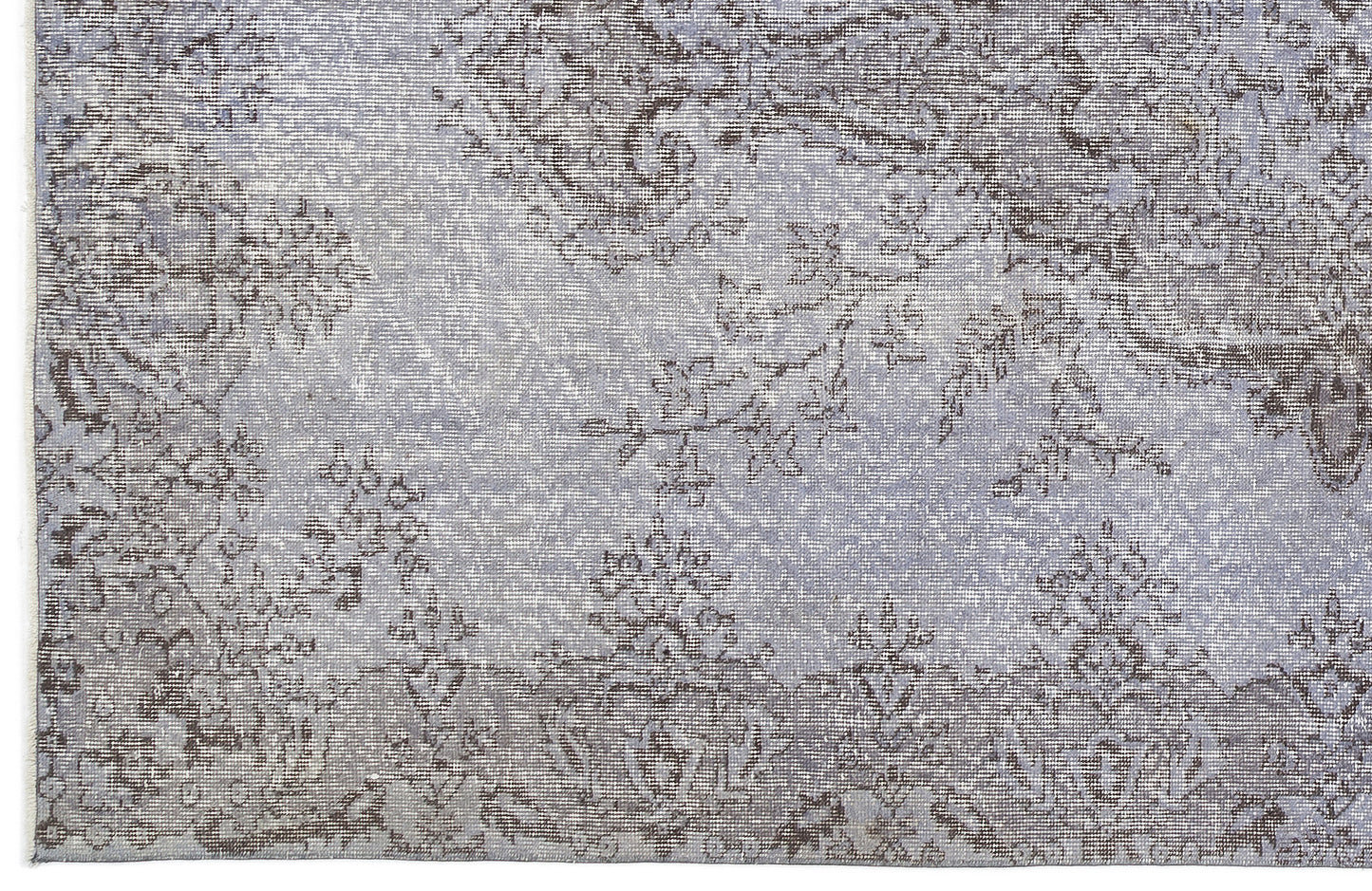 Light blue and grey rug with a distressed, traditional floral medallion pattern.