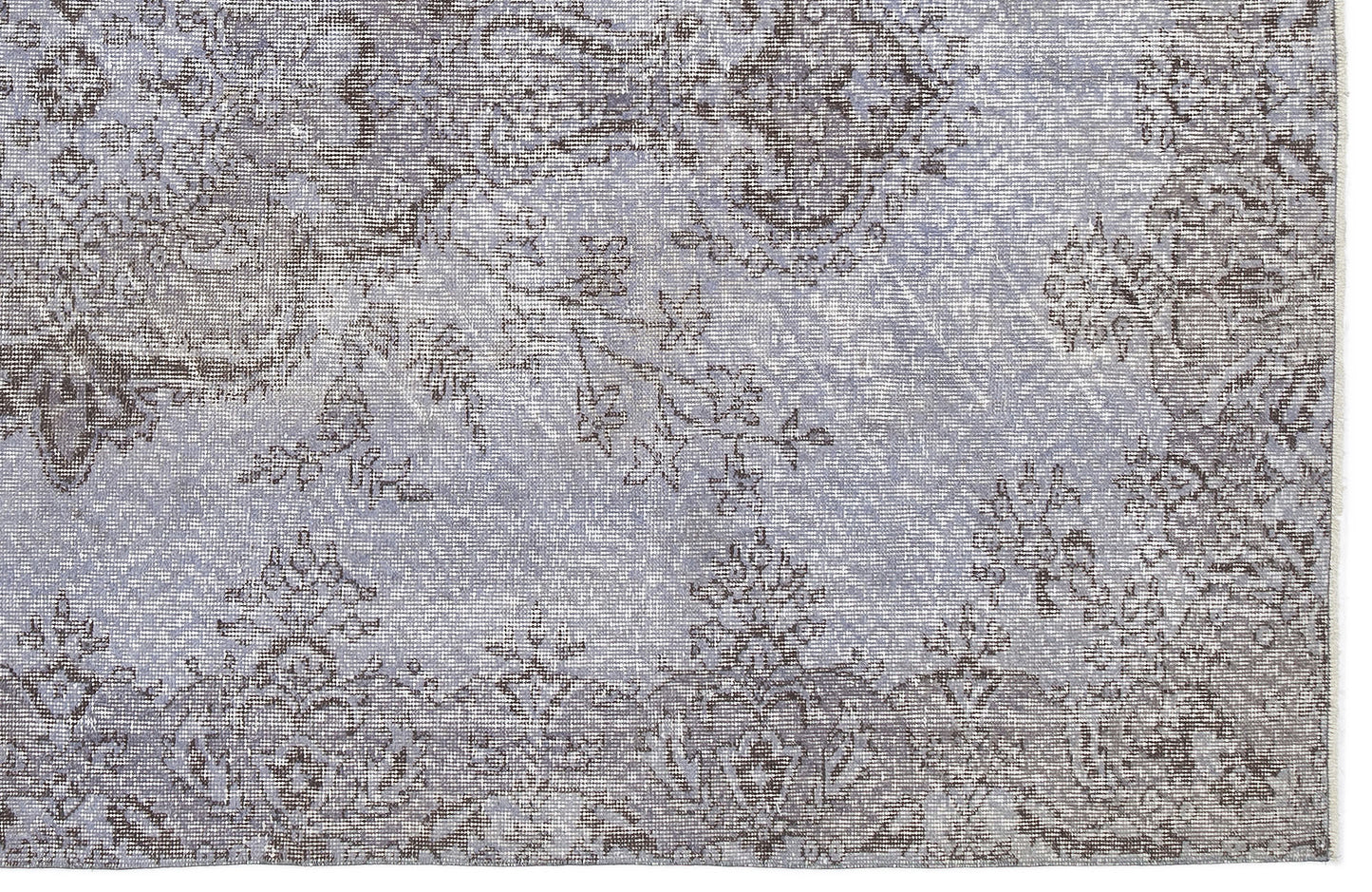 Light blue and charcoal grey rug with a distressed, traditional floral medallion pattern.