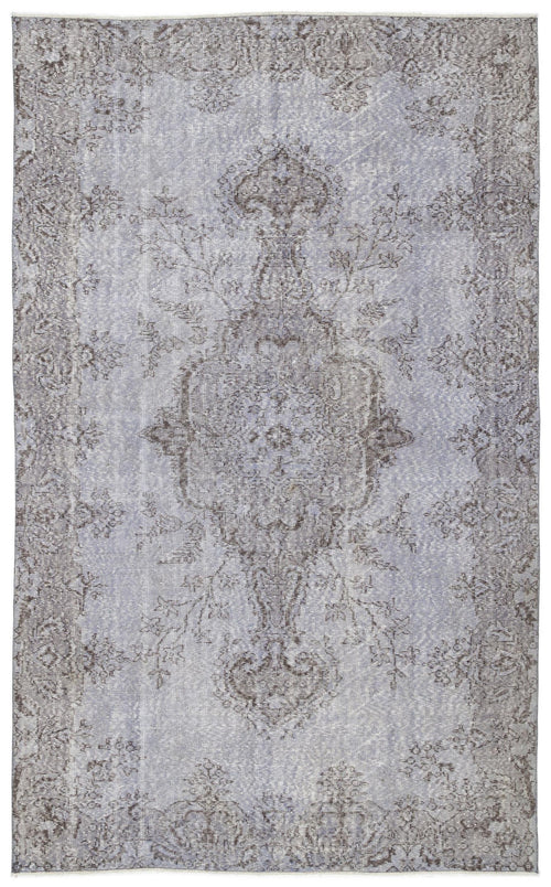 Load image 1 in gallery view. Light blue and grey distressed rug with a traditional central medallion and ornate floral border.