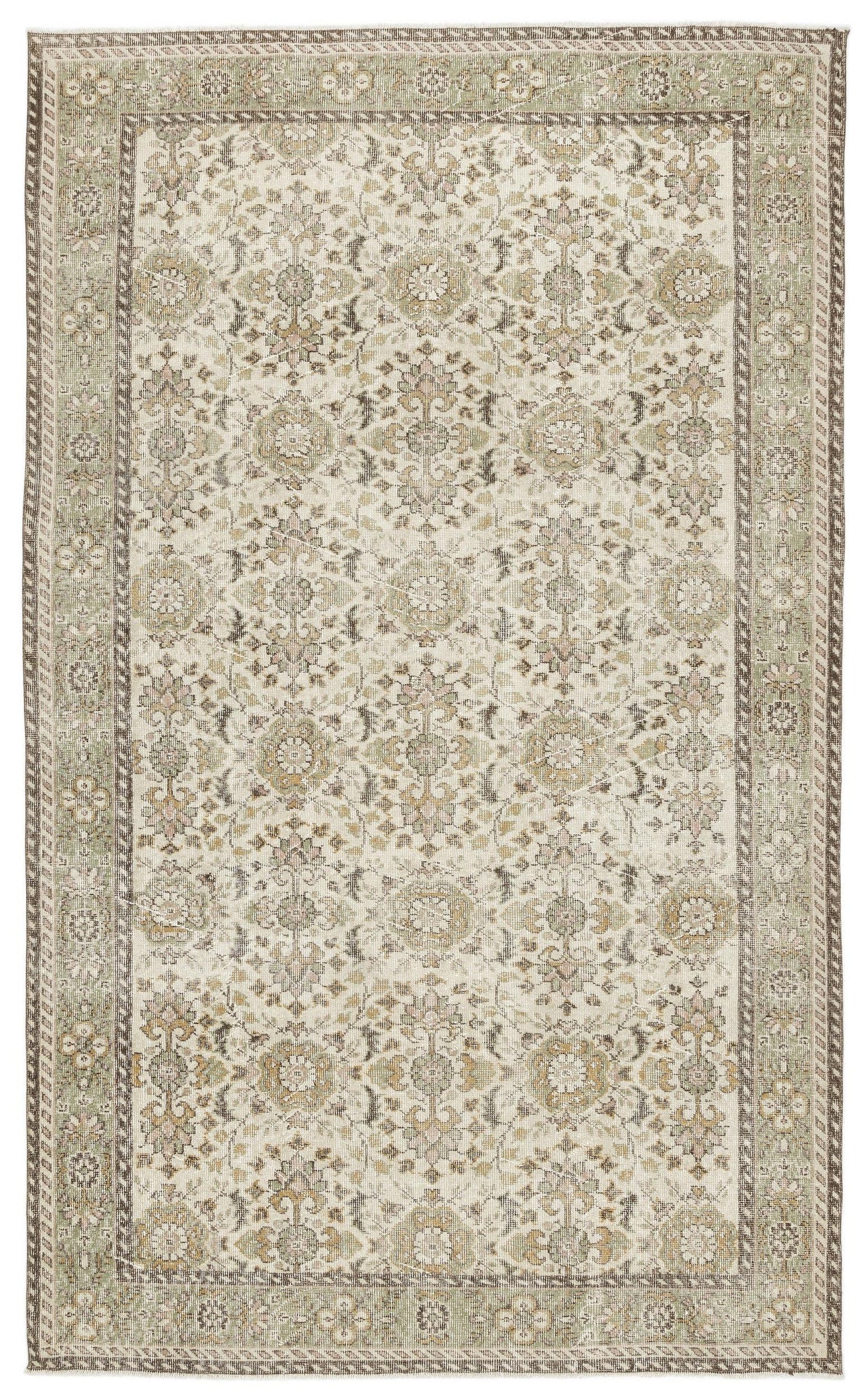 The Nizora Vintage Floral Rug (6'1" x 10'0) features an intricate, symmetrical floral and vine pattern in muted beige, cream, and sage green with decorative borders for a timeless, elegant look.
