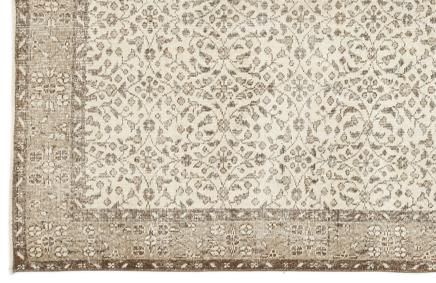 Beige and cream rug with a distressed traditional floral medallion pattern and a wide decorative border.
