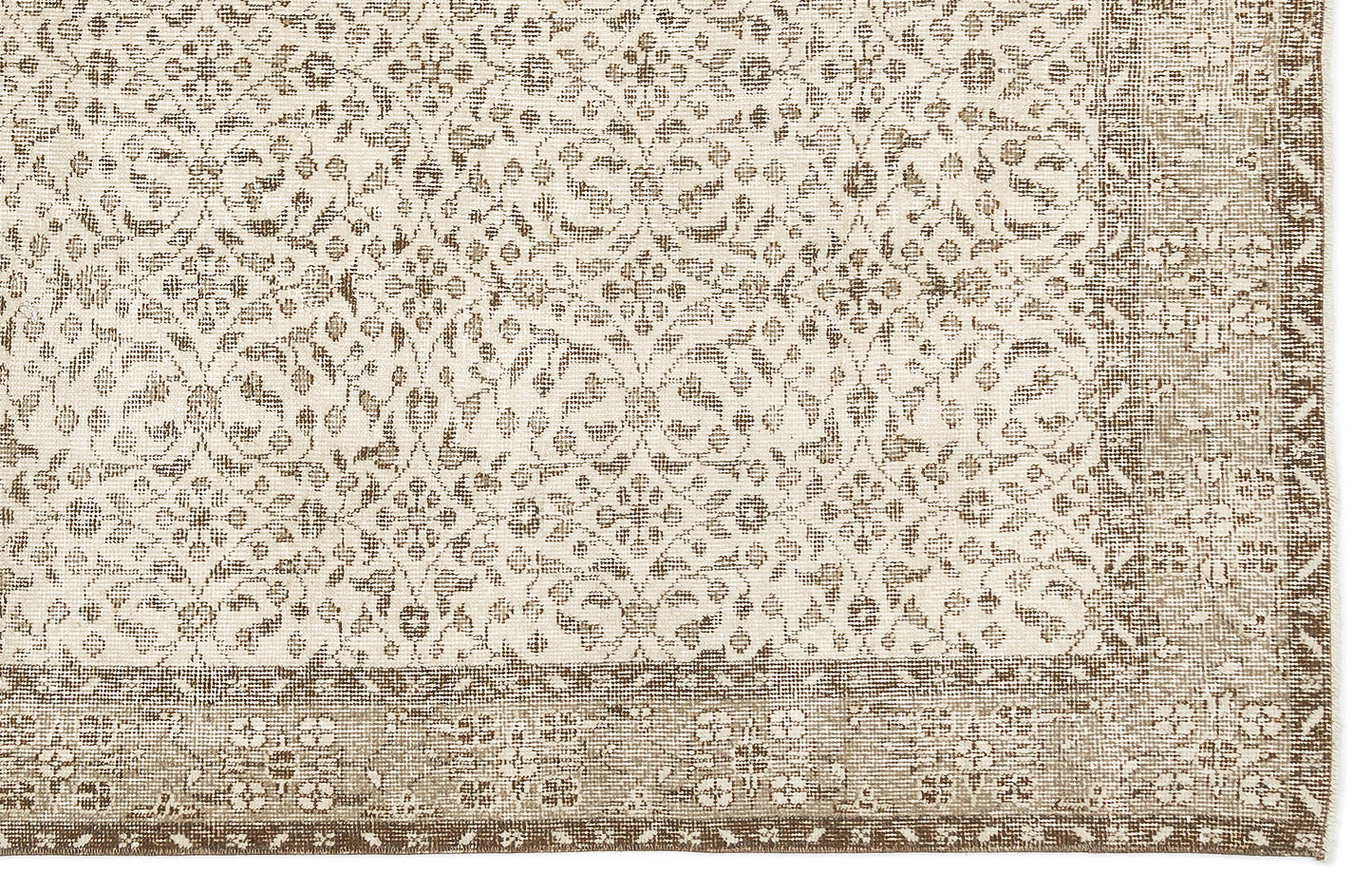 Beige and cream rug with a distressed floral medallion pattern and a wide, detailed border.