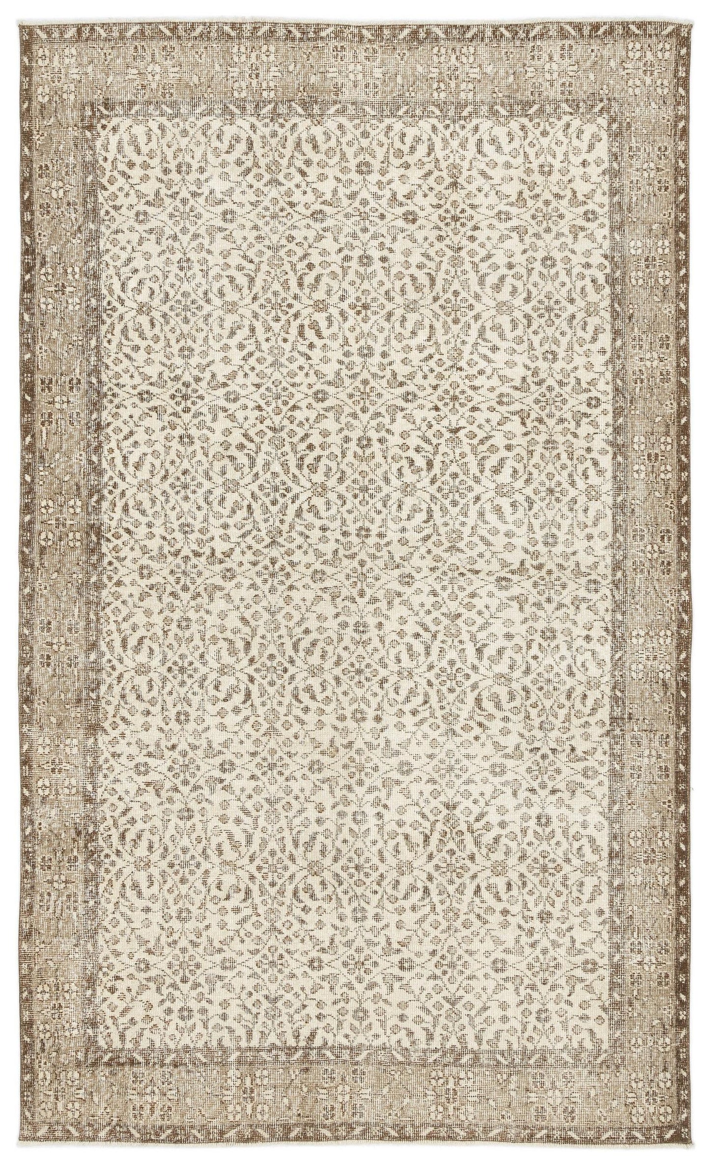 Beige and cream vintage-style rug with a distressed floral medallion pattern and a wide decorative border.