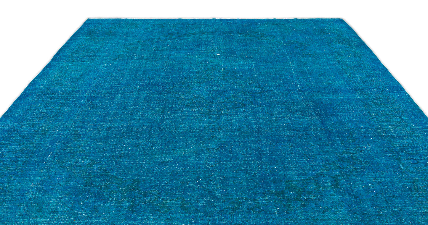 Solid bright blue vintage-style rug with a distressed, weathered texture on a white background.