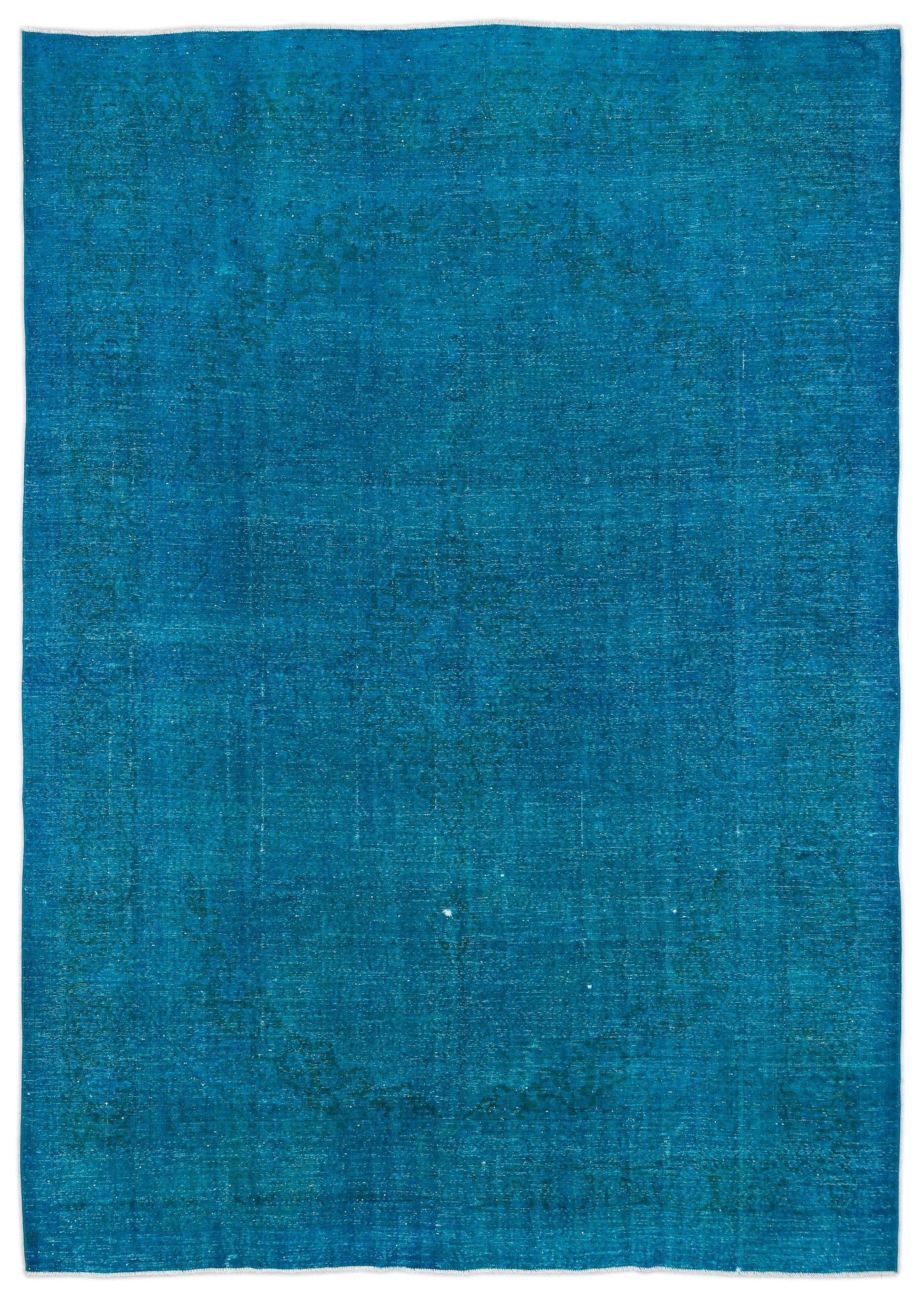 Solid teal distressed-style rug with a faint, worn-in traditional medallion pattern.