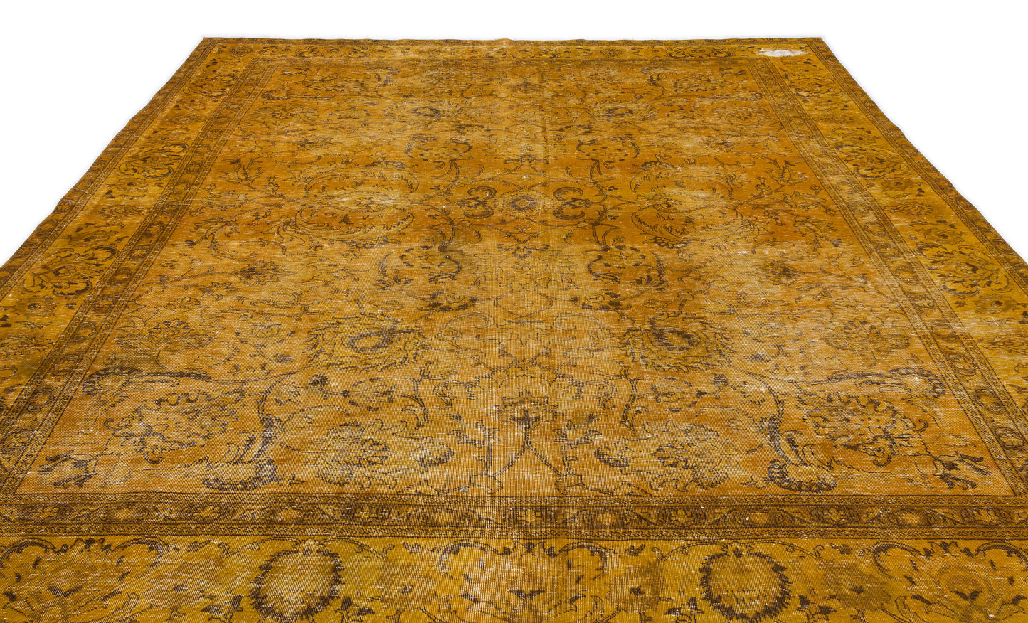 Distressed mustard yellow rug with a dark brown traditional floral medallion pattern and a wide decorative border.