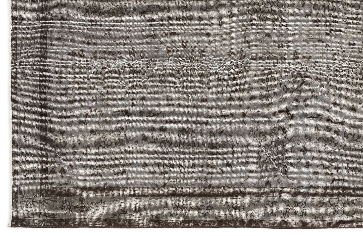 Grey and charcoal distressed rug with a faded traditional floral medallion pattern and a dark border.