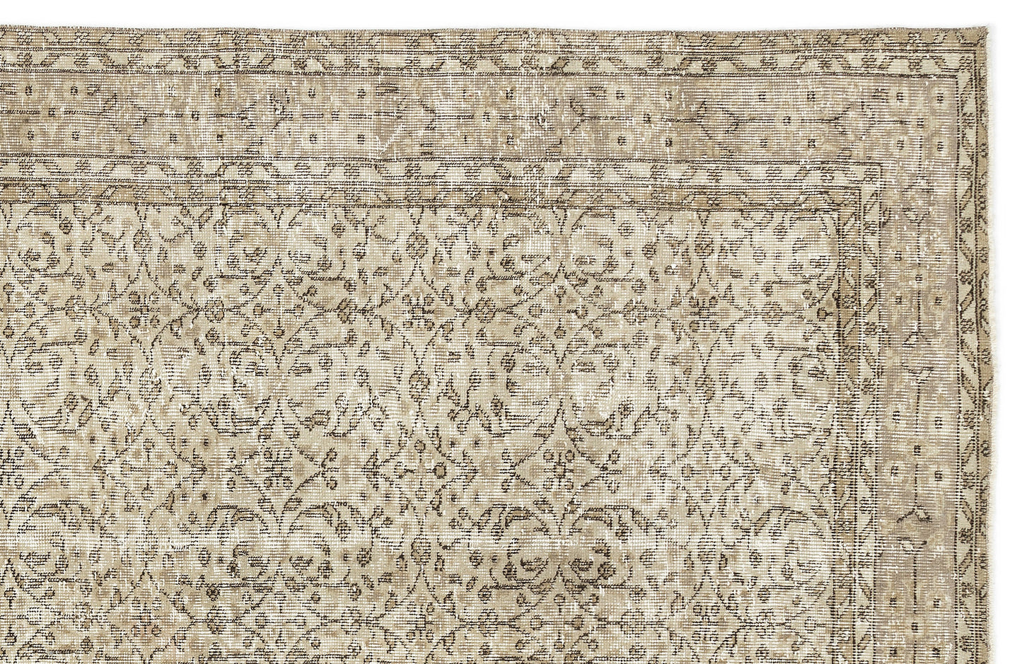 A close-up of the Coaluon - Vintage Floral Rug - 5'8 X 9'1 showcases its flatwoven build, ornate beige and light brown floral and vine motifs, a decorative border, and gentle fading that highlights its Anatolian-inspired vintage charm.