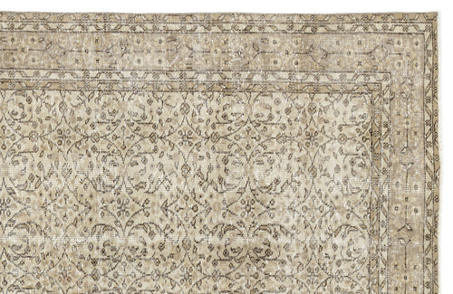 Load image 1 in gallery view. A close-up of the Coaluon - Vintage Floral Rug - 5'8 X 9'1 showcases its flatwoven build, ornate beige and light brown floral and vine motifs, a decorative border, and gentle fading that highlights its Anatolian-inspired vintage charm.