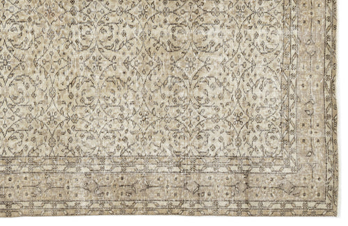 Load image 1 in gallery view. The Coaluon Vintage Floral Rug (5'8 x 9'1) features a beige and brown palette with intricate floral and diamond motifs, bordered edges, flatwoven construction, and a distressed finish for authentic Anatolian vintage appeal.