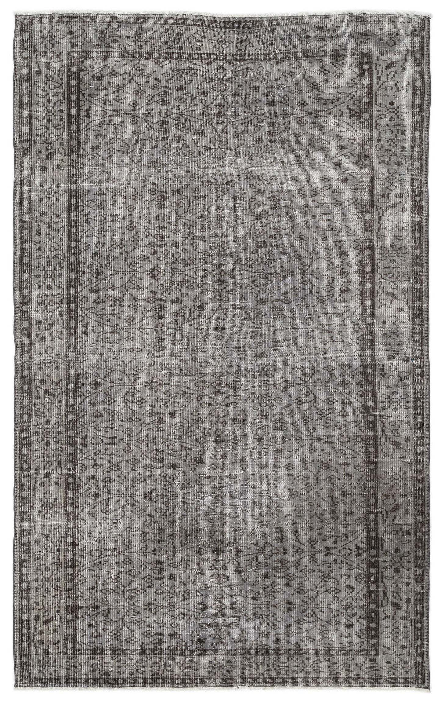 Charcoal and grey distressed vintage-style rug with a traditional floral medallion pattern and a wide border.