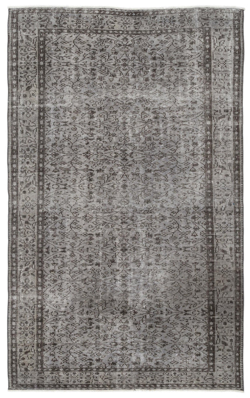 Load image 1 in gallery view. Charcoal and grey distressed vintage-style rug with a traditional floral medallion pattern and a wide border.