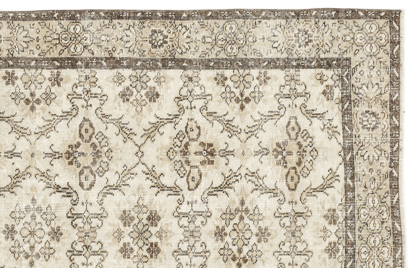 Beige and brown vintage-style rug with a distressed floral medallion pattern and a decorative border.