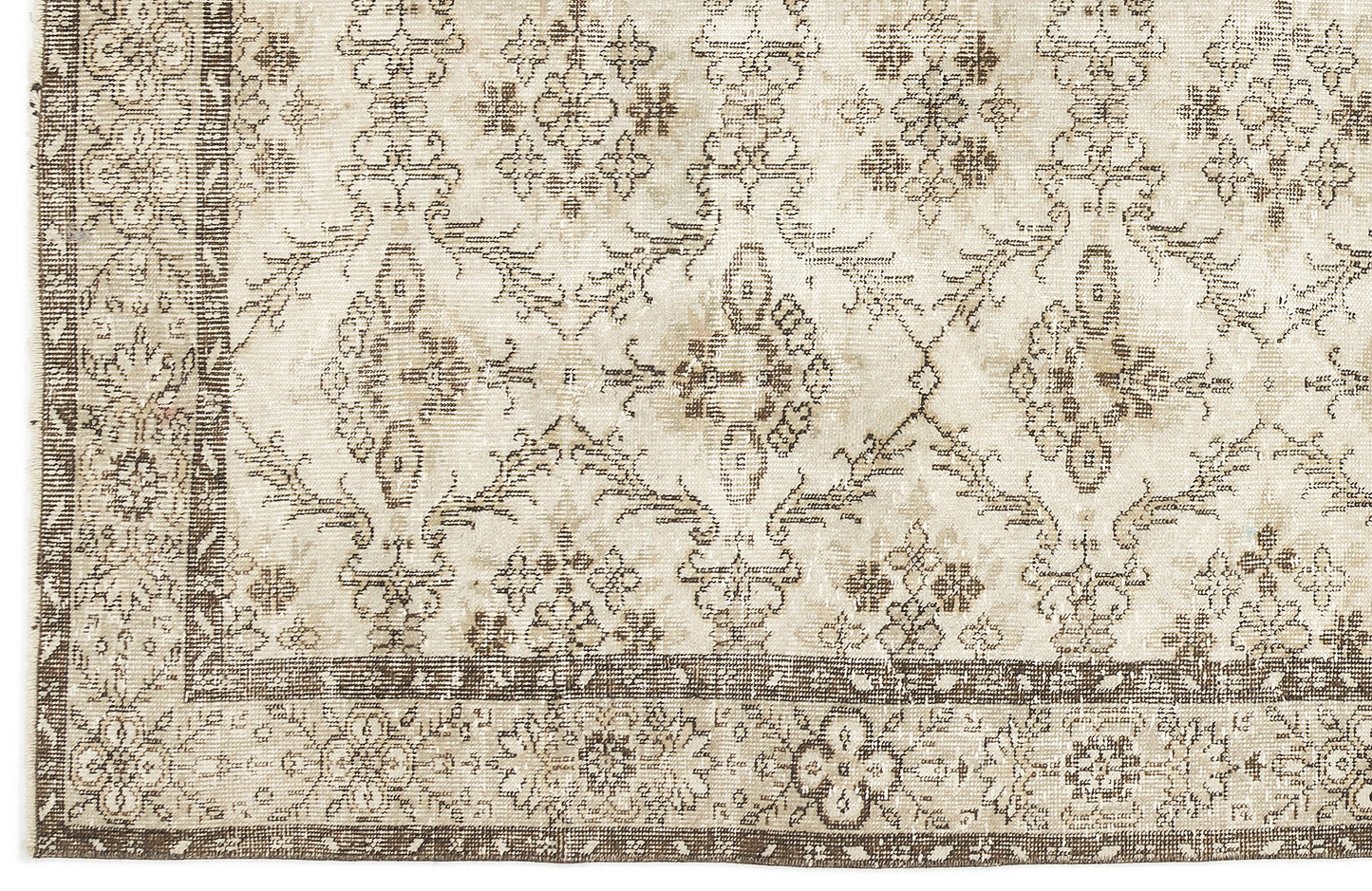 Beige and brown rug with a distressed traditional floral medallion pattern and a wide decorative border.