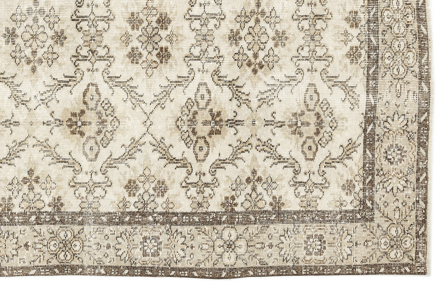 Beige and brown distressed rug with a traditional floral medallion pattern and a wide decorative border.