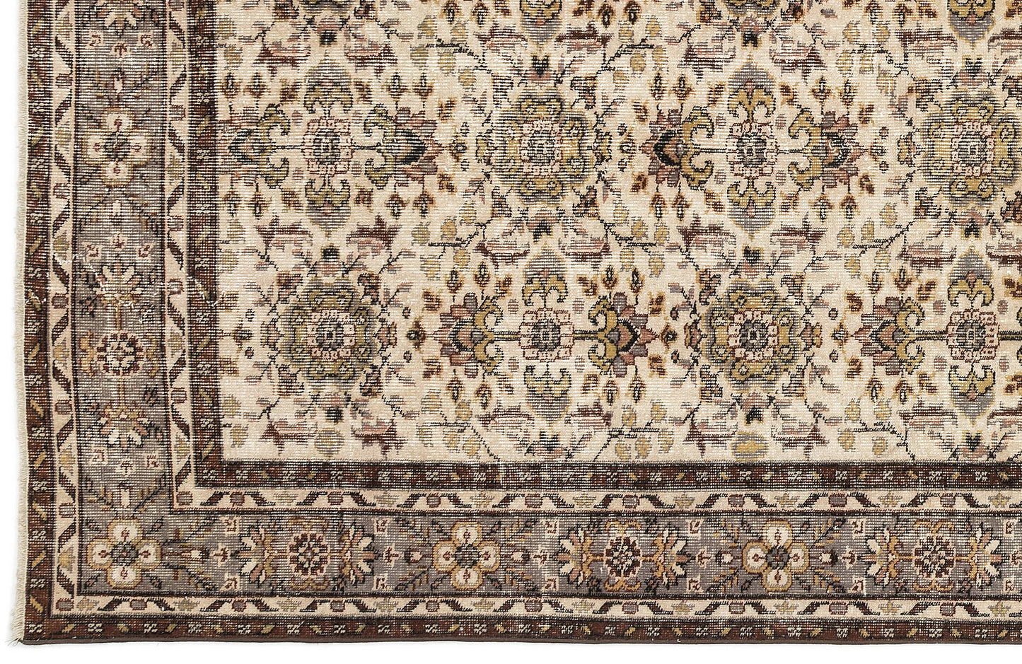 Cream rug with a traditional floral medallion pattern in brown, olive, and grey, featuring a detailed geometric border.