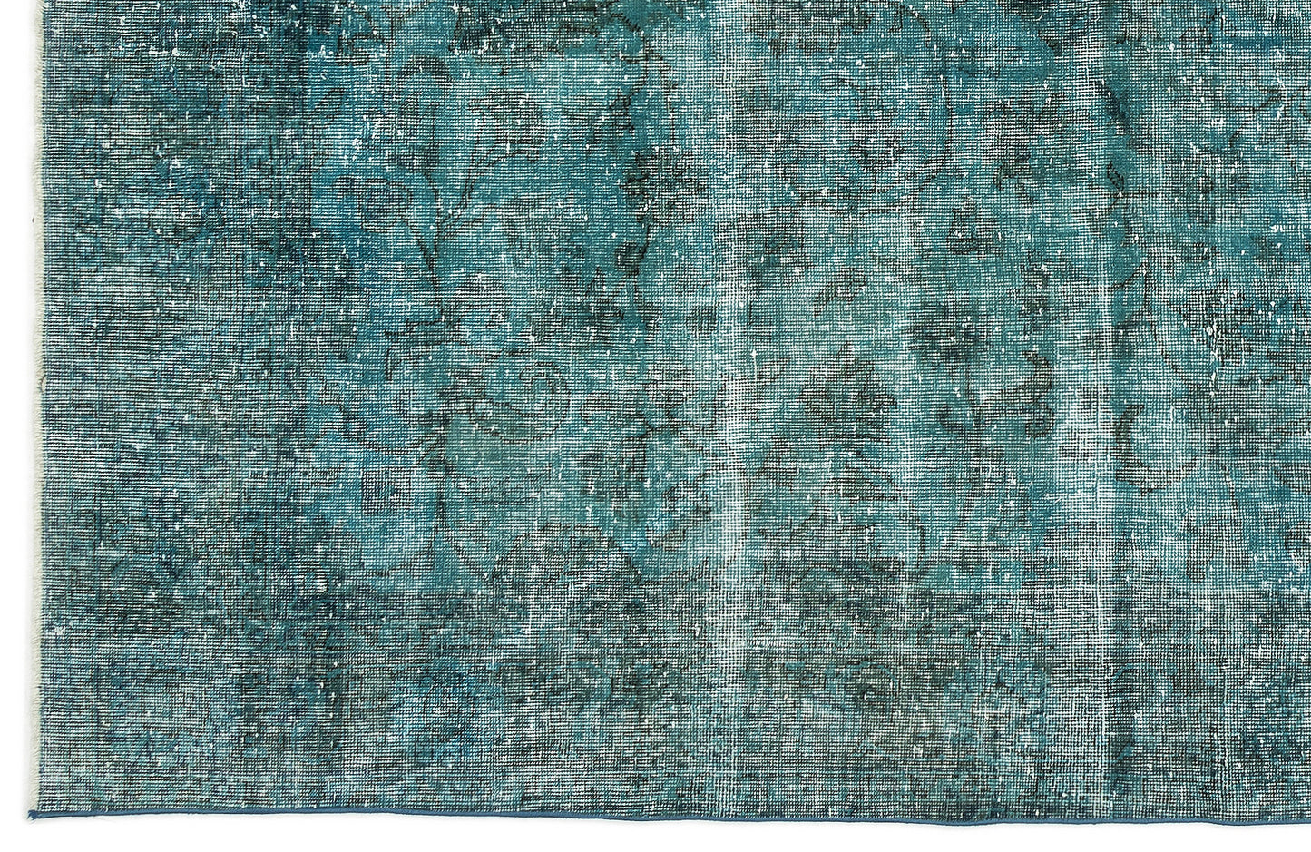 Teal and charcoal distressed rug with a faded traditional floral medallion pattern.