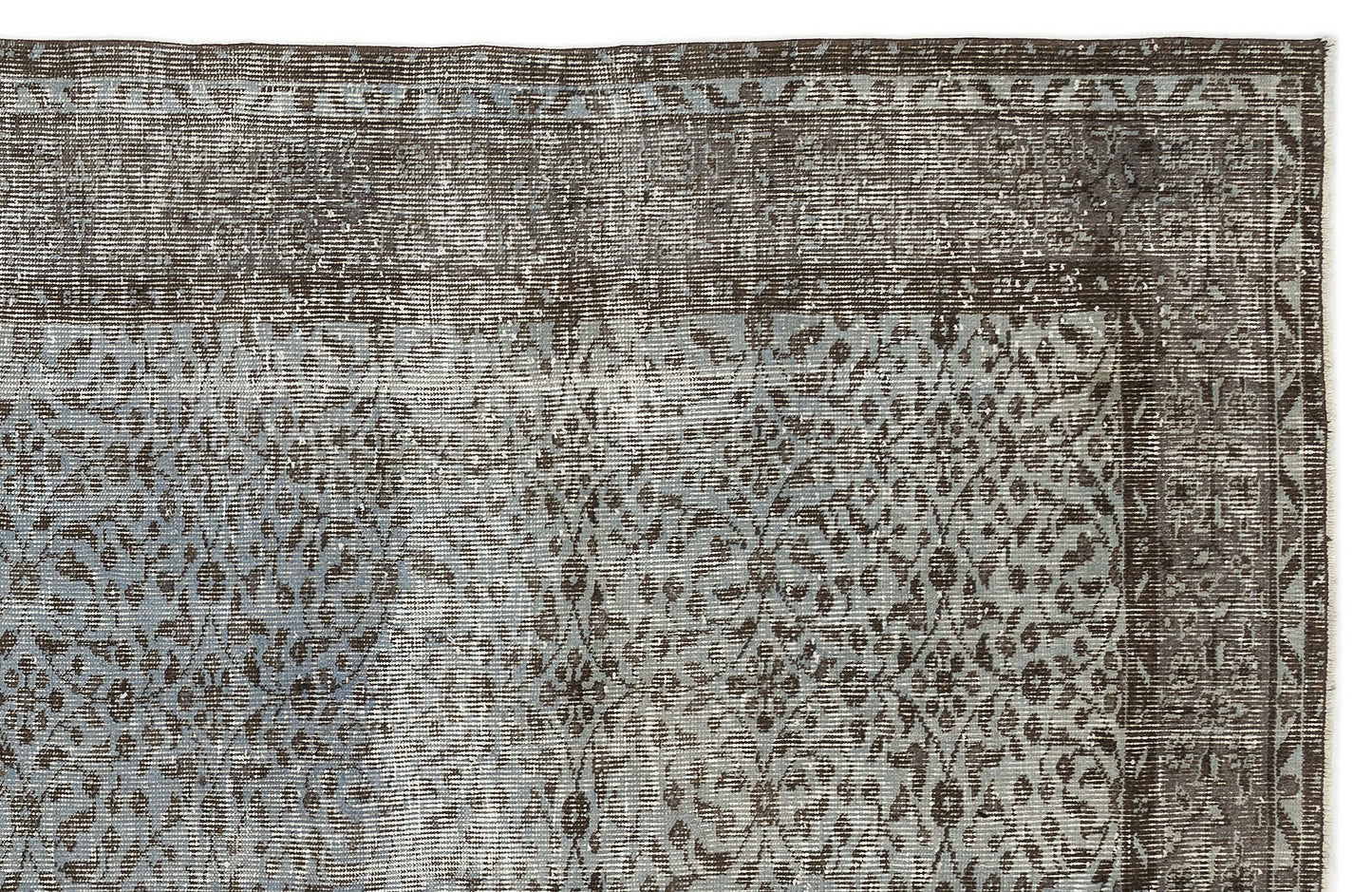 Charcoal and slate blue distressed rug with a traditional ornate medallion pattern and a geometric border.