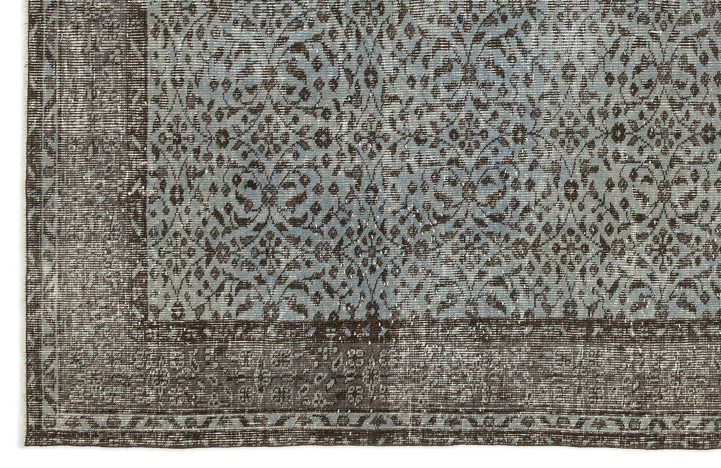 Distressed slate blue and dark brown rug with an intricate floral medallion pattern and a wide decorative border.
