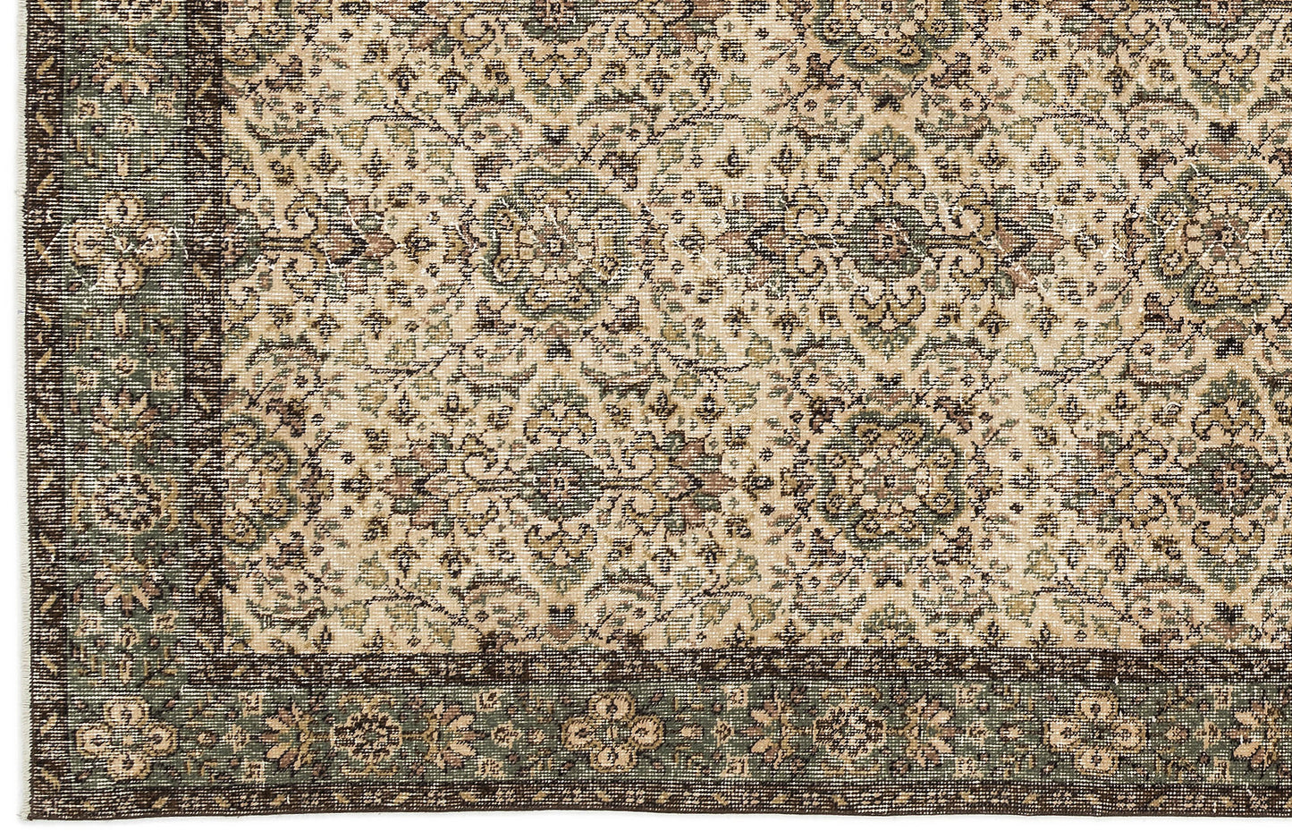 Beige, sage green, and dark brown traditional rug with a distressed floral medallion pattern and a wide border.