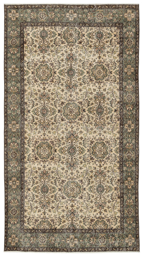 Load image 1 in gallery view. Sage green and beige vintage-style rug with a traditional floral medallion pattern and a dark brown border.