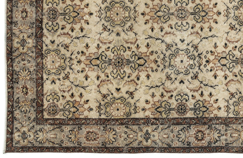 Load image 1 in gallery view. Beige and brown traditional rug with a distressed floral medallion pattern and a detailed geometric border.