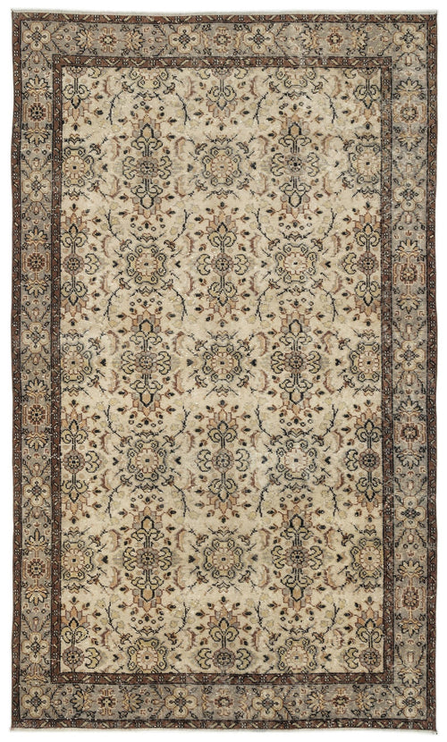 Load image 1 in gallery view. Beige and brown traditional rug with a repeating floral medallion pattern and a decorative border.