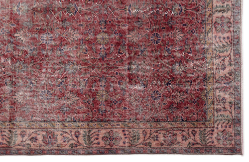 Load image 1 in gallery view. Distressed red and pink traditional rug with a faded floral medallion pattern and a detailed border.
