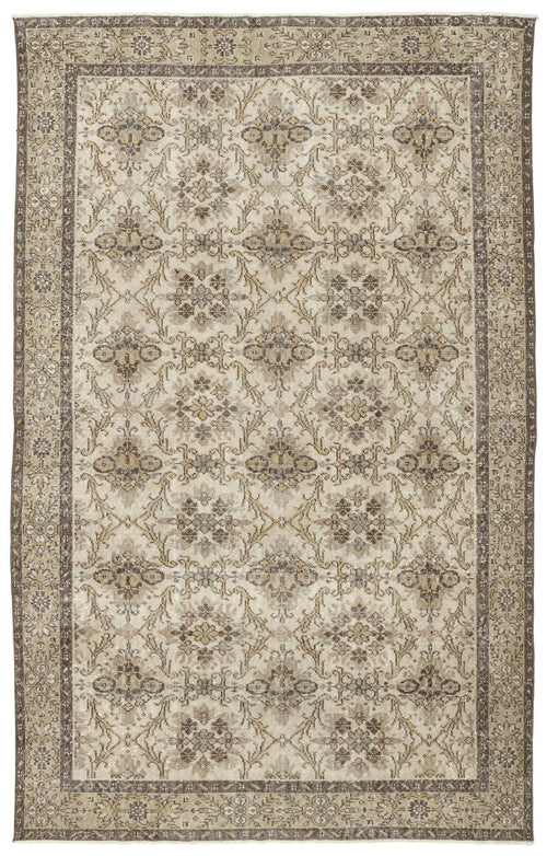 Load image 1 in gallery view. The Sadeane Vintage Floral Rug (6'0 x 9'8) features a detailed beige, brown, and gray floral vine pattern with an ornate geometric floral border, reflecting classic Anatolian design.