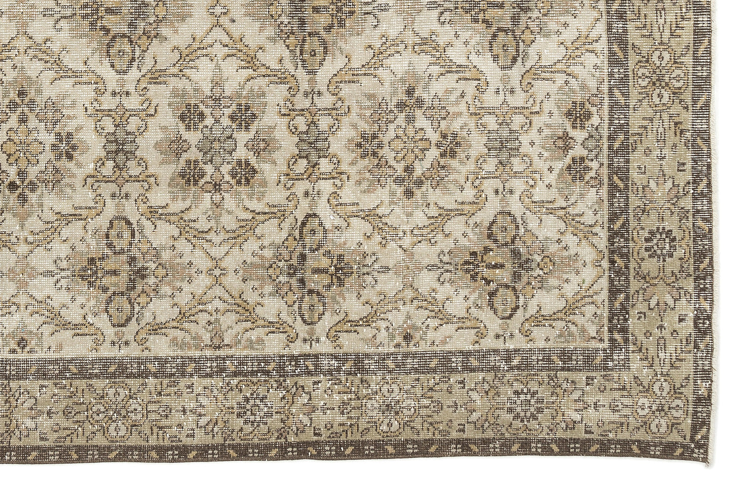 The Sadeane Vintage Floral Rug (6'0 X 9'8) features an ornate blend of beige, brown, and cream tones in intricate floral and geometric patterns, finished with a detailed dark border.