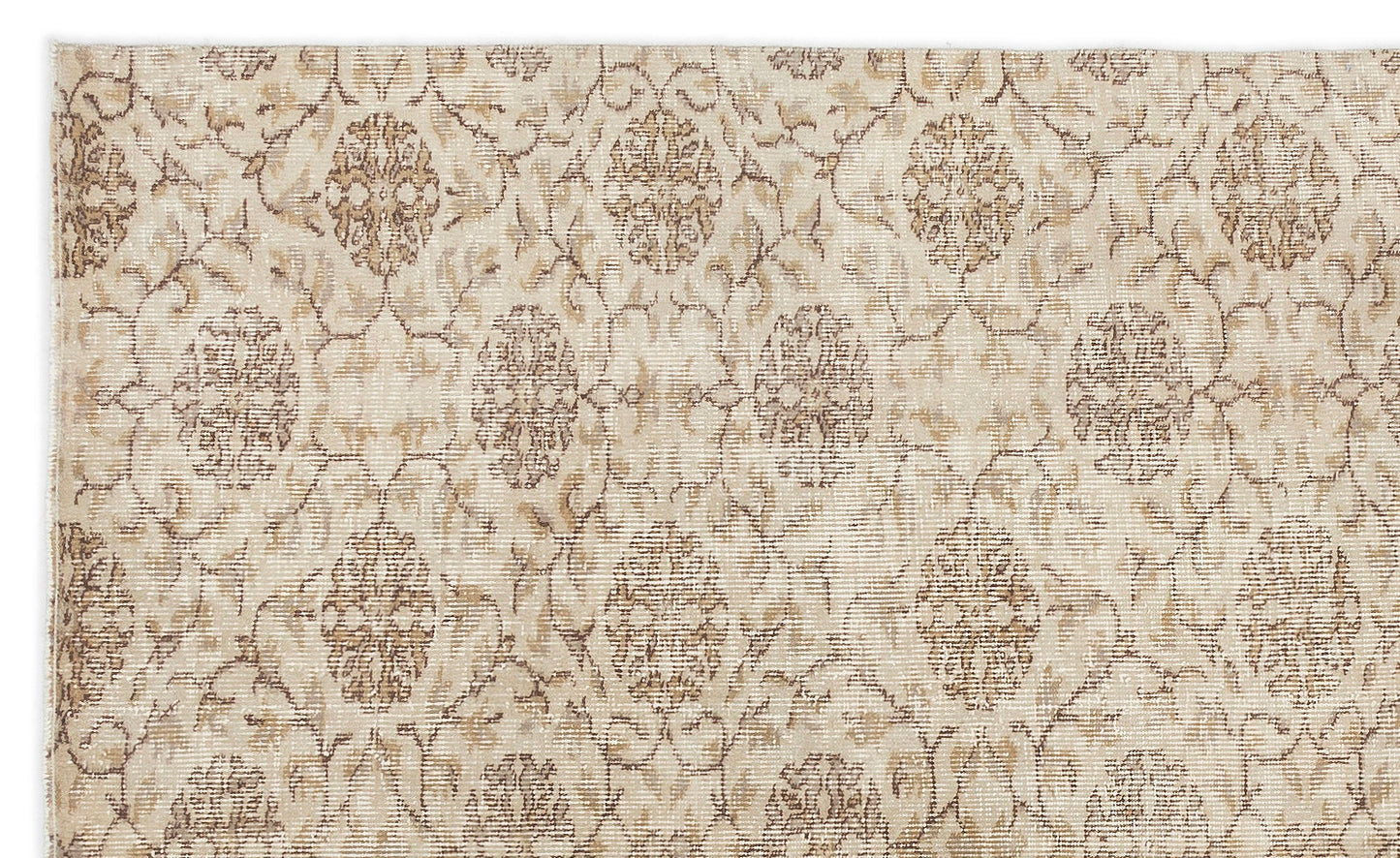 Beige and tan traditional rug with a repeating distressed floral medallion pattern.