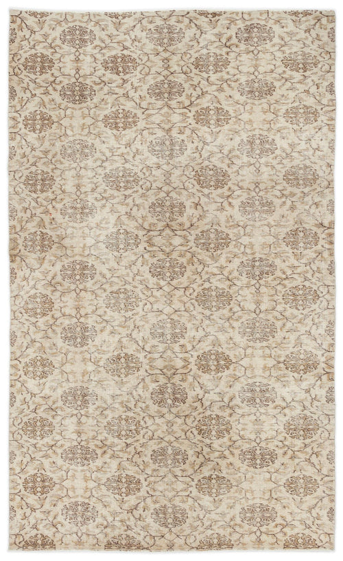 Load image 1 in gallery view. Beige and taupe vintage-style rug with a repeating floral medallion pattern on a white background.