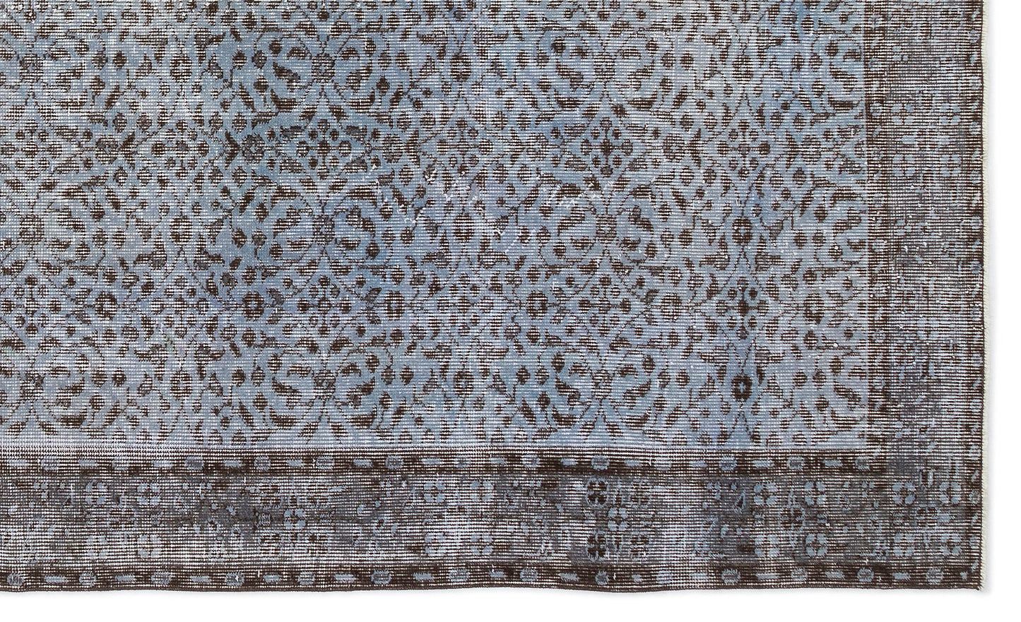 Blue and dark brown rug with a distressed traditional floral medallion pattern and a wide decorative border.