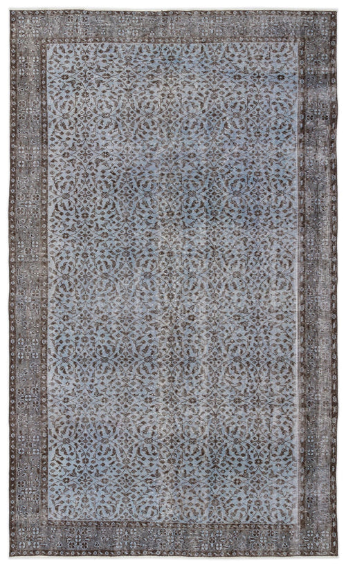 Load image 1 in gallery view. Blue and charcoal grey vintage-style rug with a distressed floral medallion pattern and a wide decorative border.
