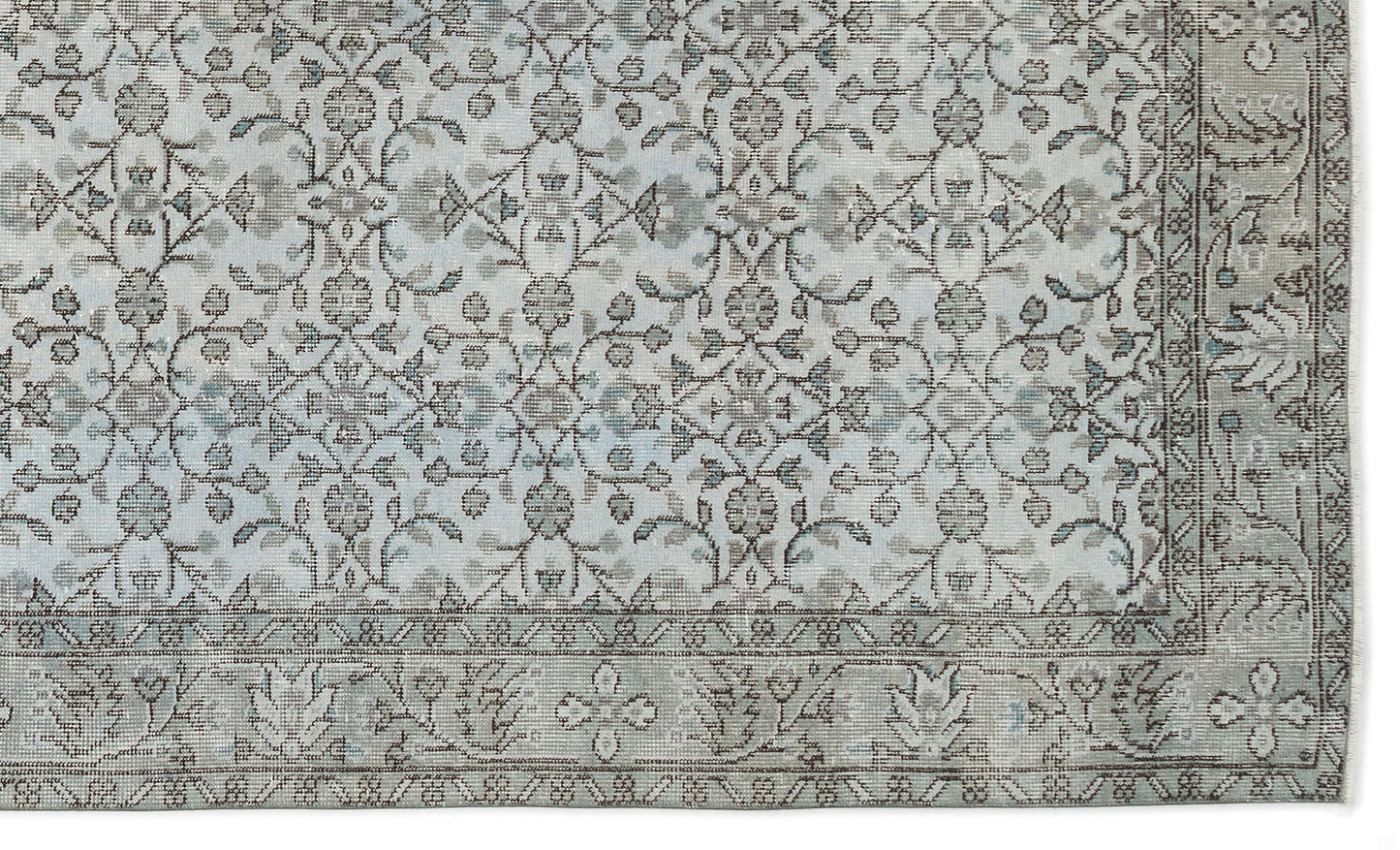Light blue and grey traditional rug with a distressed floral medallion pattern and a decorative border.