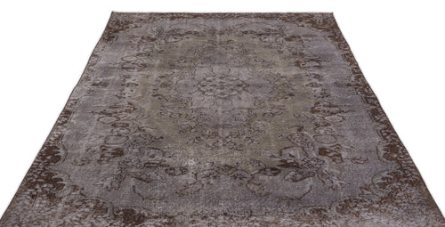 Load image 1 in gallery view. Distressed brown and grey vintage-style rug with a faded floral medallion pattern on a white background.