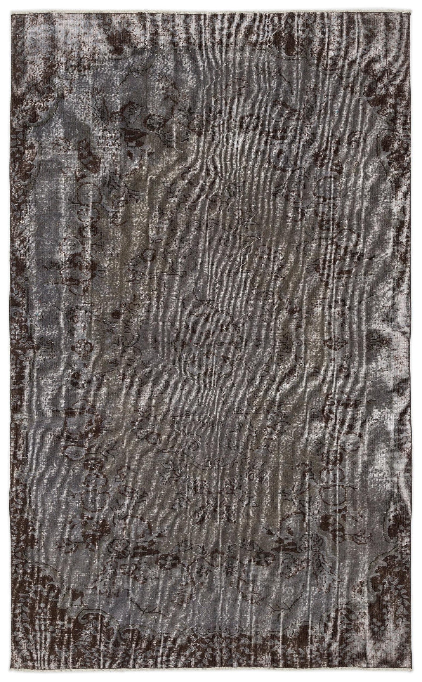 Charcoal and grey distressed rug with a faded traditional floral medallion pattern.
